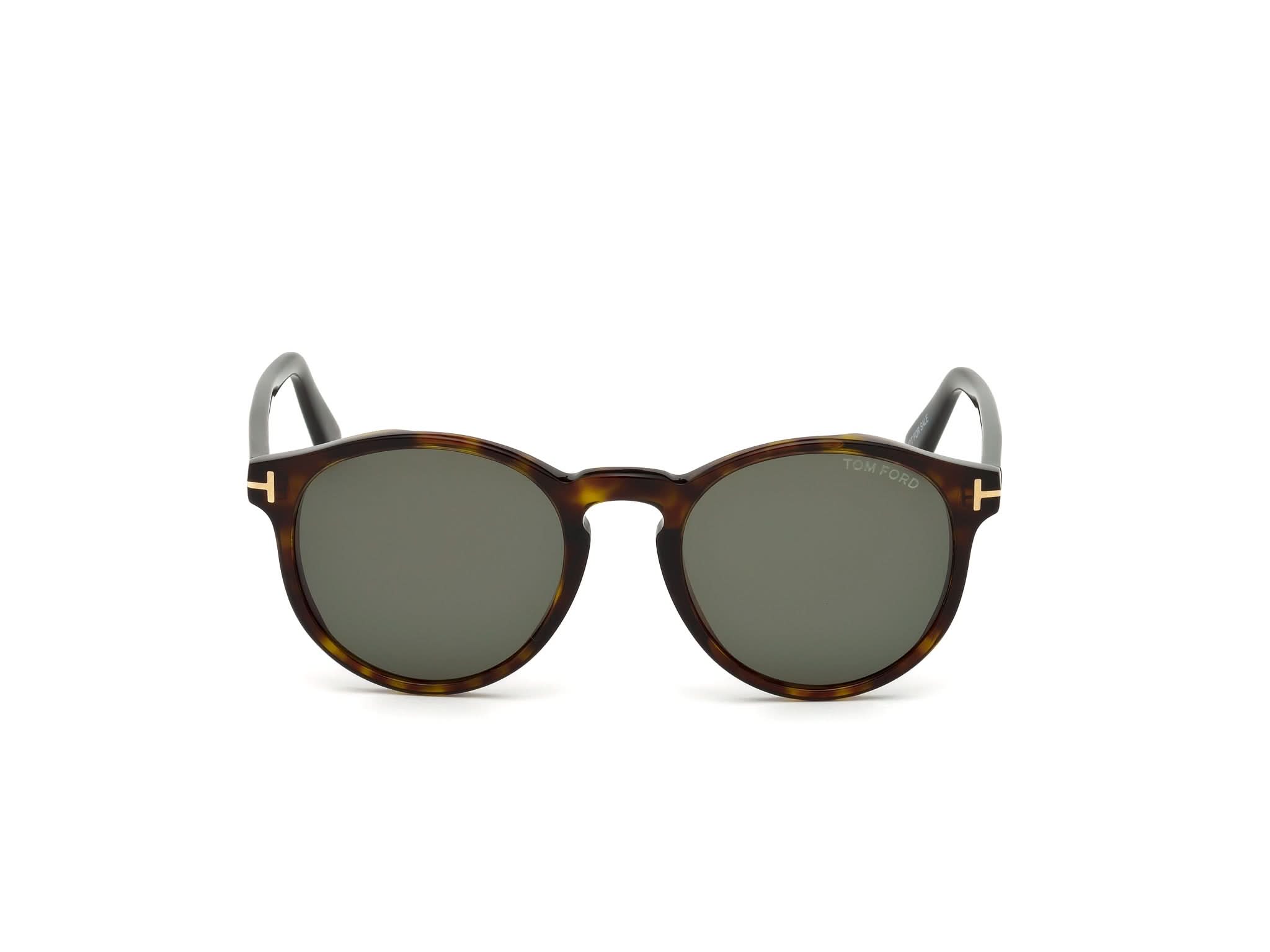 Sunglasses with tortoiseshell frame and dark lenses on a white background#color_dunkel Havana