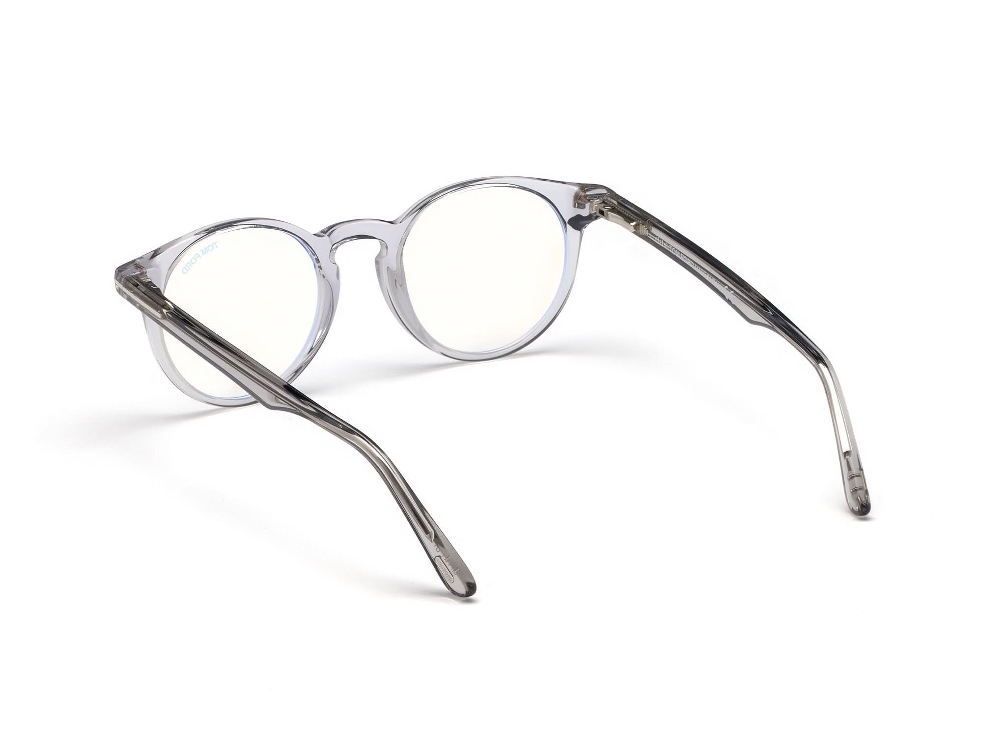 Right side view of Tom Ford FT5557 1#color_grey translucent